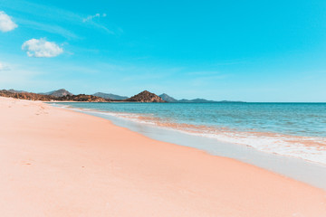 Daylight landscape of Porto Giunco's beach, soft waves, beach and sand
