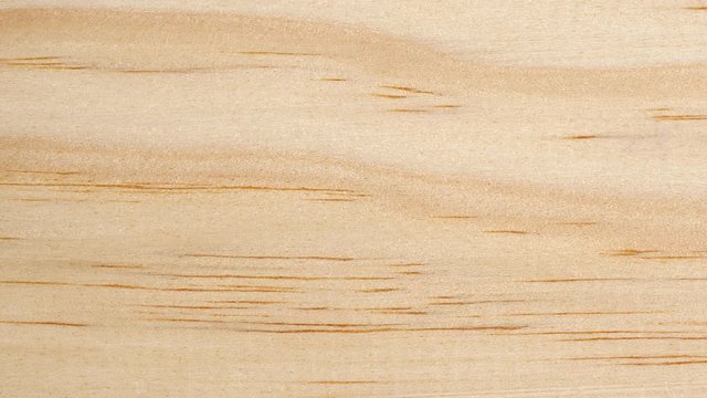 Wooden board surface tracking. Wood texture close up. Wooden background. Dolly shot, top view. 4K