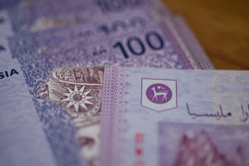 Malaysia currency of Malaysian ringgit banknotes background. Paper money of hundred ringgit notes on etreme closeup. Financial concept.