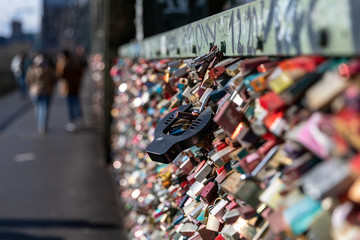 Lovers locks are covering the railings of Hohenzollern bridge in Cologne