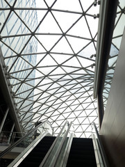 escalators under a geometric glass cover