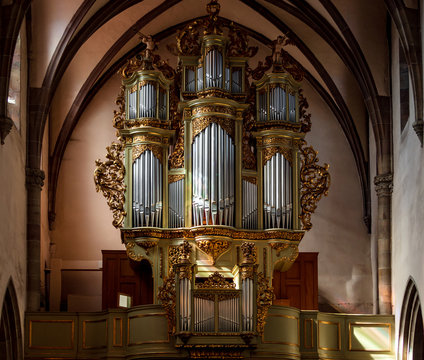 A stunningly beautiful organ in a church in Alsace. The interior of the catholic cathedral.