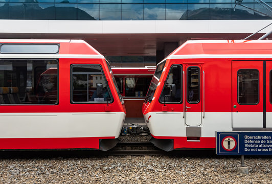 A train of Swiss railways arrived at the station. Trains are one of a tourist attraction in Switzerland.
