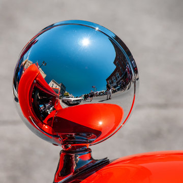 Red Hot Rod Car Reflected In Chrome Headlamp