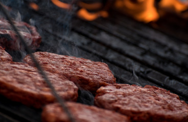 Hamburger meat on a grill,  Bbq Concept