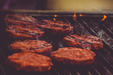 Hamburger meat on a grill,  Bbq Concept