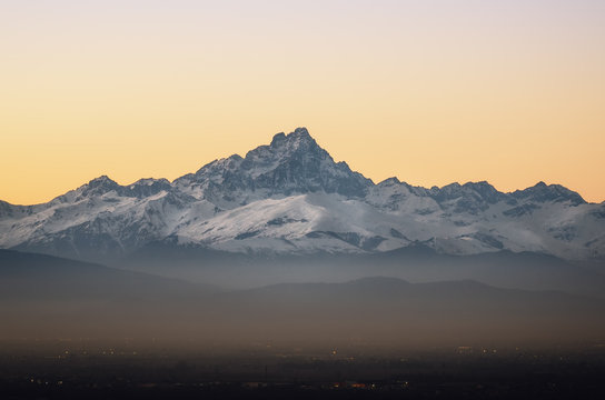 the Mount Viso (Monviso), one of the main peaks of the piedmontese Alps (Italy) seen from the town of Mondovi at sunset