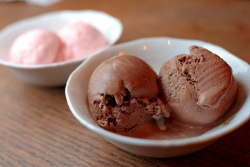 chocolate ice cream in bowl on wooden table