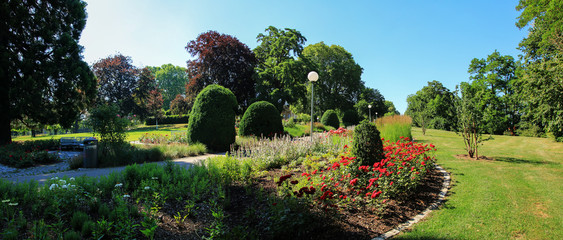 historical Rosenstein park, recreational area Stuttgart, with benches, trees and flowers