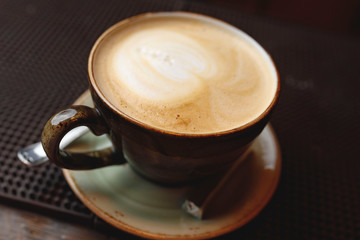 cup of coffee on black background