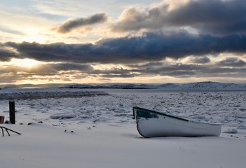 Boat on frozen bay
