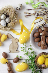 colorful easter eggs and spring flowers - 327954046