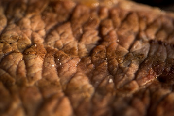 Close up of a raw steak been cooked