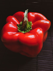 red pepper on a black background