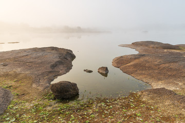 Sunrise with fog in the natural park of Los Barruecos. Extremadura. Spain.
