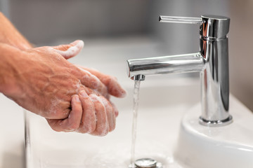 Coronavirus virus spreading prevention wash hands with soap rubbing nails and fingers washing frequently with running water or using hand sanitizer gel.