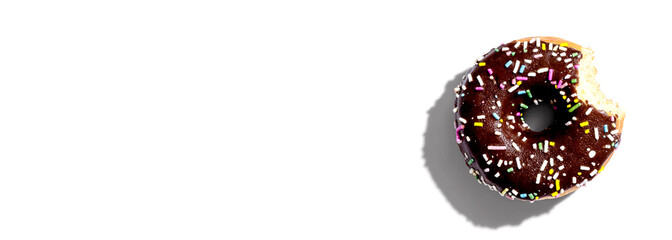 Chocolate glazed donut overhead view flat lay