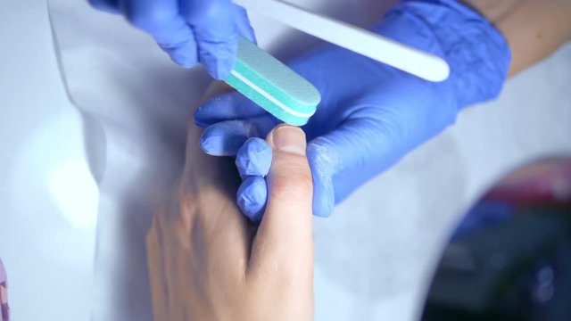 close-up. manicure. deburring scissors. manicure process for men.