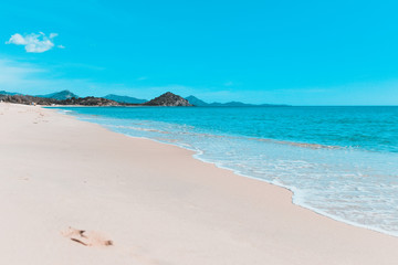 Daylight landscape of Porto Giunco's beach, soft waves, beach and clouds
