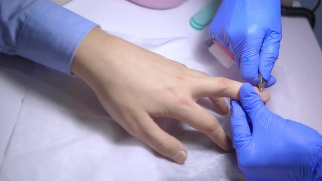 close-up. manicure. deburring scissors. manicure process for men.
