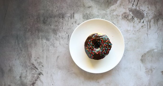 Stop Motion Video of Chocolate Donut being Eaten until it Disappears