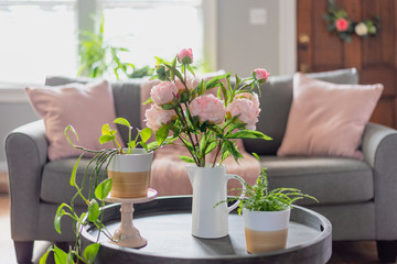 Brightening up the living room with plants and flowers for Spring - 327964201