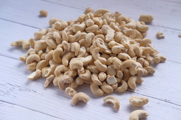 Close up of fresh cashew nut on white table 