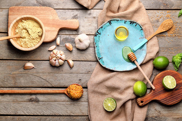 Ingredients for honey mustard sauce on wooden background