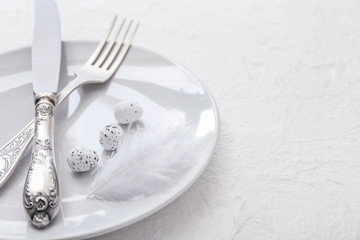 Beautiful Easter table setting on white background