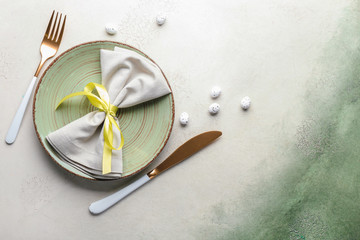 Beautiful Easter table setting on color background