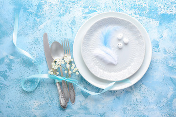 Beautiful Easter table setting on color background