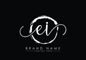 E and I Initial handwriting logo design with brush circle. handwritten logo for fashion, team, wedding, luxury logo.