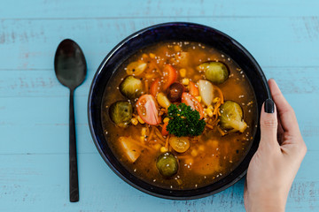 plant-based recipes, vegan spicy soup with fresh mixed veggies and brussel sprouts