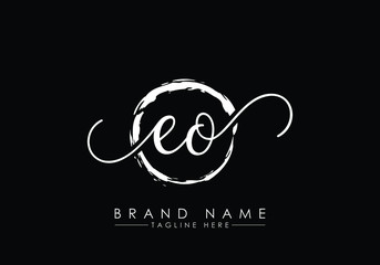 E and O Initial handwriting logo design with brush circle. handwritten logo for fashion, team, wedding, luxury logo.