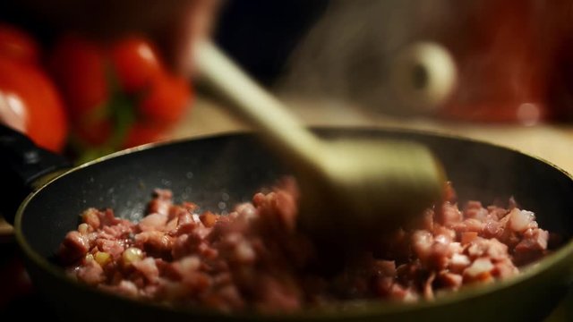 preparing bacan in a pan in the kitchen, close-up footage