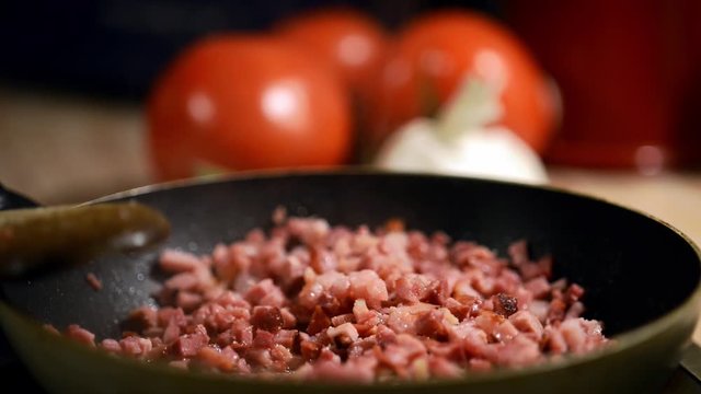 Becon frying in a pan macro footage