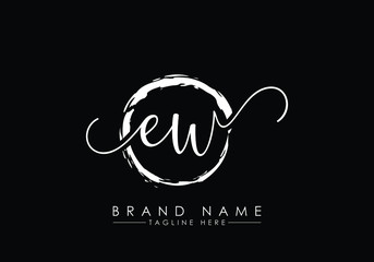 E and W Initial handwriting logo design with brush circle. handwritten logo for fashion, team, wedding, luxury logo.