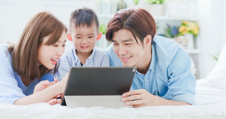 Parent play with child by tablet