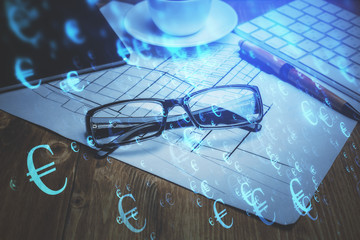 Financial chart hologram with glasses on the table background. Concept of business. Double exposure.