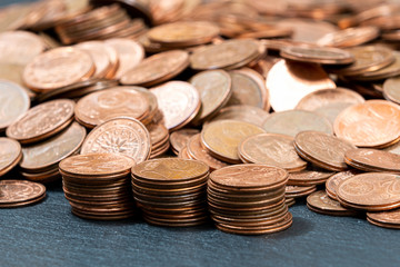 One, two euro cents coins on dark background. European money.