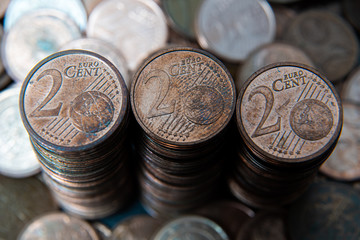 One, two euro cents coins on dark background. European money.