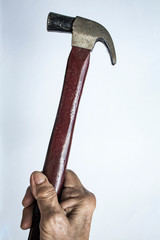 Senior Woman's left hand holding hammer on white background, Construction building and repair tool concept