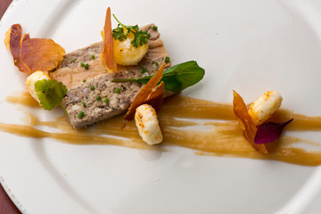 Duck Terrine. Traditional French cuisine a loaf of forcemeat or aspic, similar to a pâté, cooked...