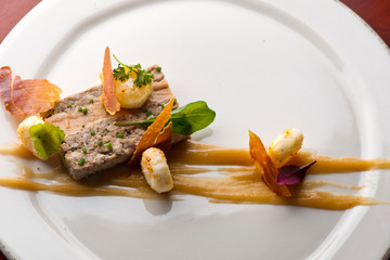 Duck Terrine. Traditional French cuisine a loaf of forcemeat or aspic, similar to a pâté, cooked...
