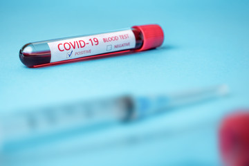 Test tube with blood sample for COVID-19 test, novel coronavirus 2019 found in Wuhan, China....