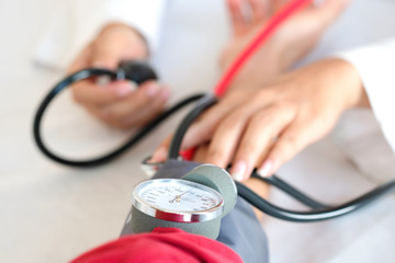 Man check blood pressure monitor and heart rate monitor with digital pressure gauge. Health care and Medical concept