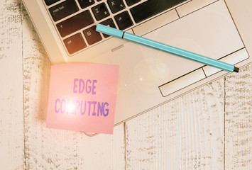 Handwriting text Edge Computing. Conceptual photo practice of processing data near the edge of your network Trendy slim silver metallic laptop blank sticky pad pen lying vintage table