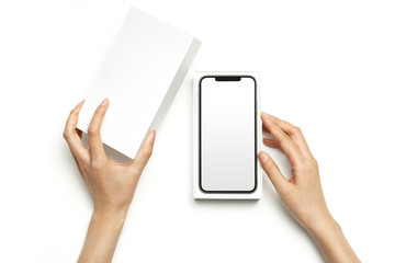 Woman hand hold a smartphone package isolated on white.