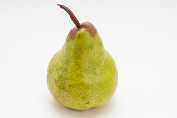 green ripe pear on a white background