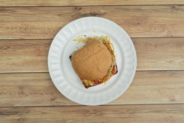 Hamburger with meat, tomato, lettuce.